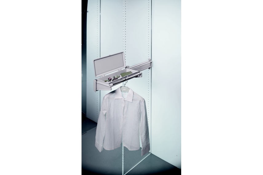 Ambos side-mounted jacket rack with accessory drawer.