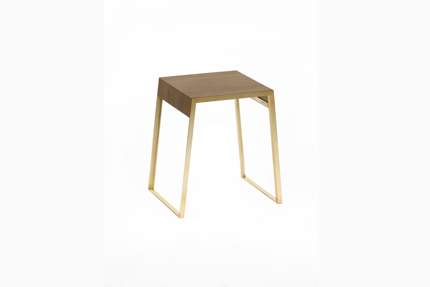 The Goldie side table has a simple and modern design, made from brass and rimu.