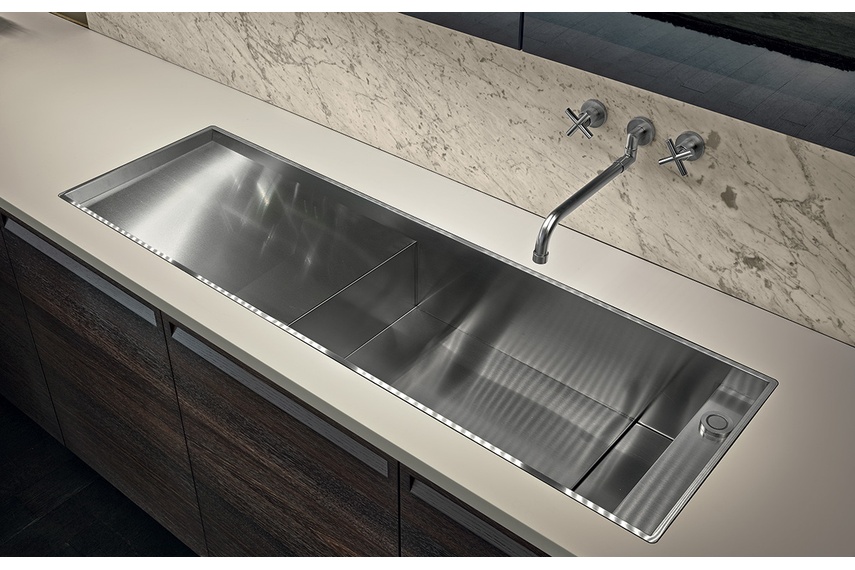 Combines beautiful timbers and highly precise stainless steel elements.