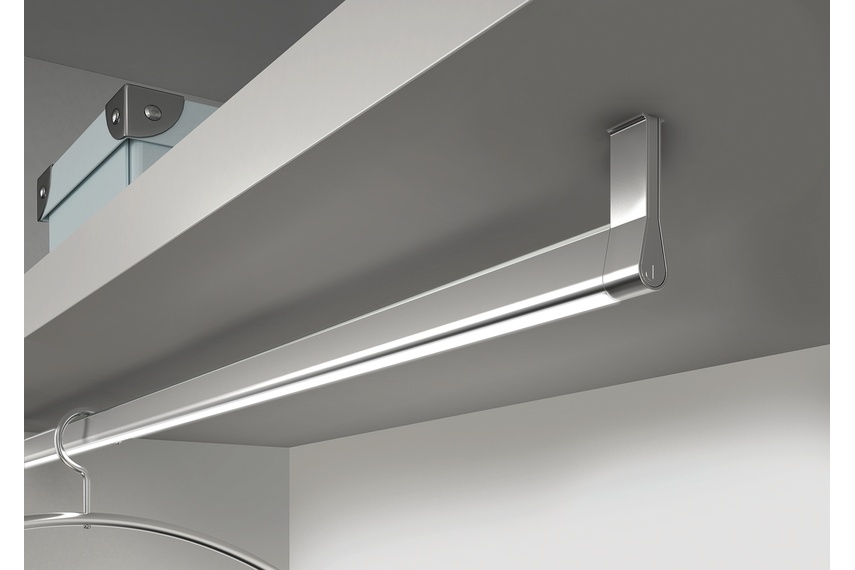 Domus Line Goccia LED lighting profile integrated with wardrobe rail.